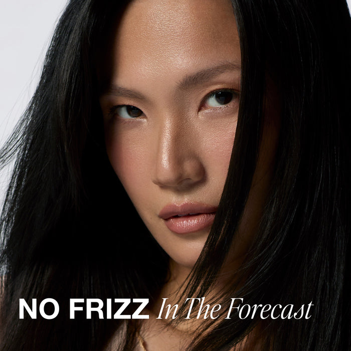 Model with smooth, frizz-free hair after using Paul Mitchell 3-Day No Frizz Spray.