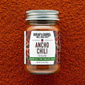 Bottle of Burlap & Barrel Ancho Chili on a textured brown background