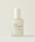 A frosted glass bottle of Balancing Mist with aloe leaf juice and rose water, topped with a white cap, is set against a plain light background. The minimal label features black text.