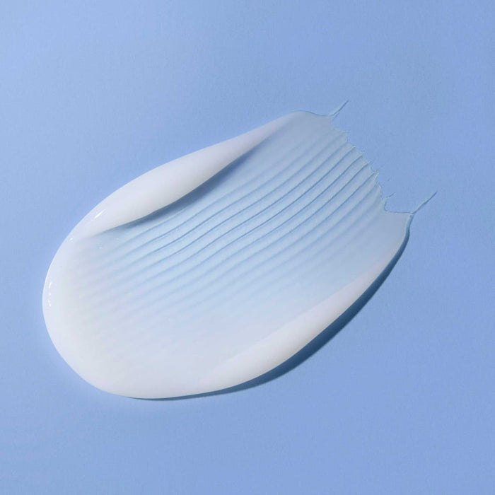Bond Rx Leave-In Treatment smear on a blue background