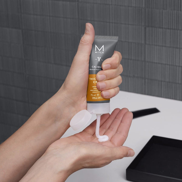 Image of someone dispensing Mitch Calibrate into their hands in a lifestyle setting