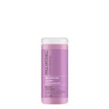A bottle of Clean Beauty Blonde Shampoo by Paul Mitchell with a purple label on a white background.