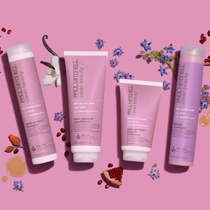 Clean Beauty Color Protect Collection artistic image with ingredients surrounding the bottles on a light pink background