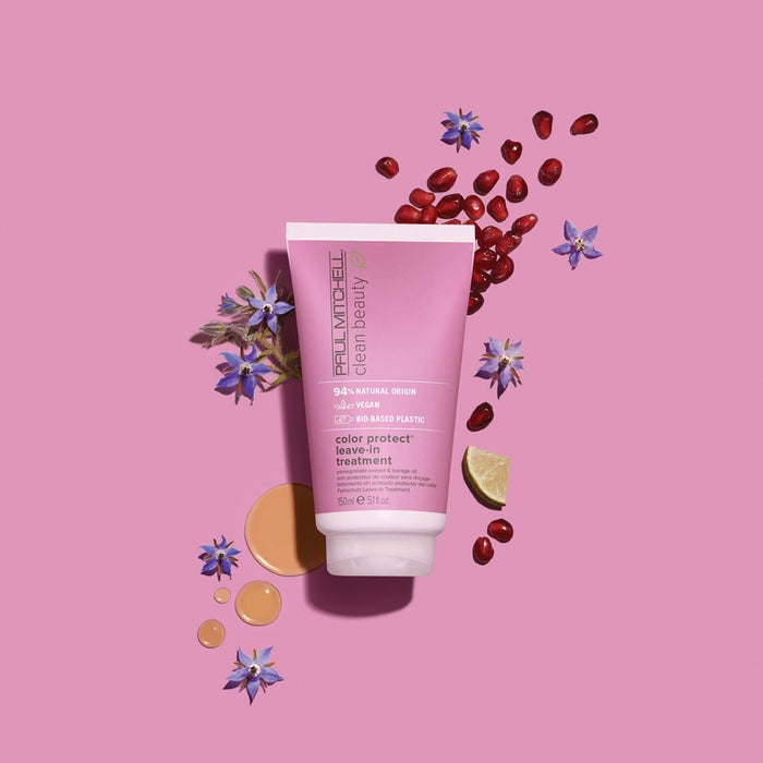 Clean Beauty Color Protect Leave-In Treatment artistic image with ingredients surrounding the tube on a light pink background
