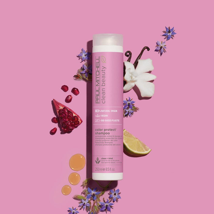 Clean Beauty Color Protect Shampoo artistic image with ingredients surrounding the bottle on a light pink background