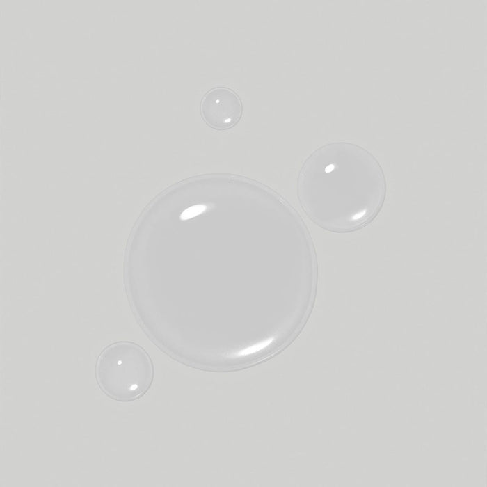 Clean Beauty Scalp Therapy Drops smear on a neutral background