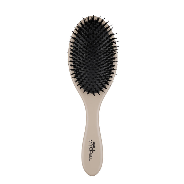 The Dressing Brush is designed to smooth styles and distribute scalp oils to enhance natural shine.