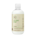 A bottle of Tea Tree Hemp Restoring Conditioner & Body Lotion on a white background