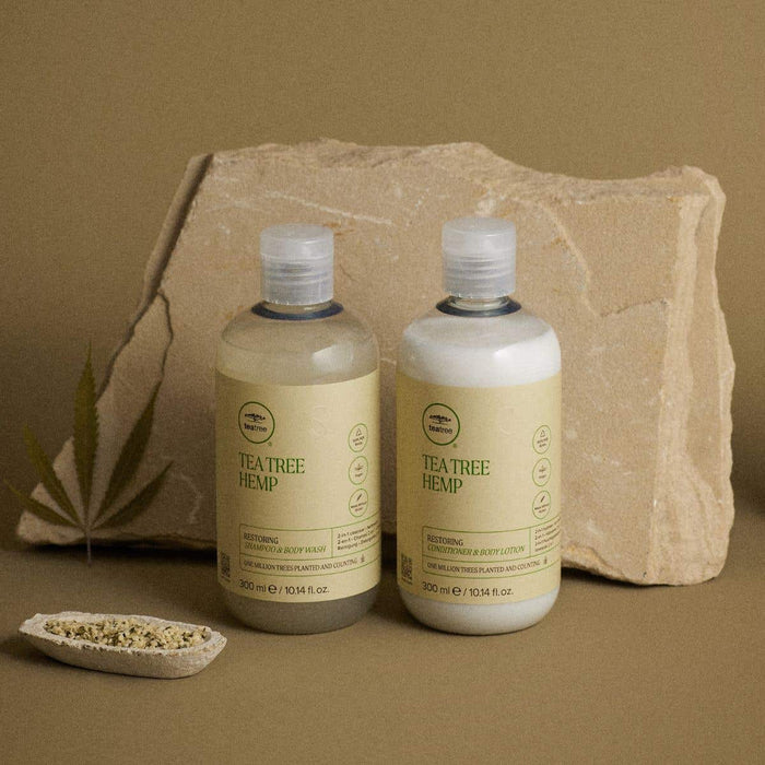 Hemp Restoring Shampoo and Body Wash + Restoring Conditioner and Body Lotion in an artistic setting