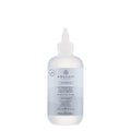 A white bottle with a pump dispenser labeled HydraSoft Glossing Treatment from Awapuhi Wild Ginger.