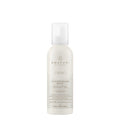 A pump bottle of Awapuhi Wild Ginger HydroCream Whip Mousse hair styling mousse.