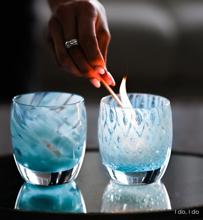 i do, i do set including good choice and blessing on a reflective table. good choice being lit with a match.