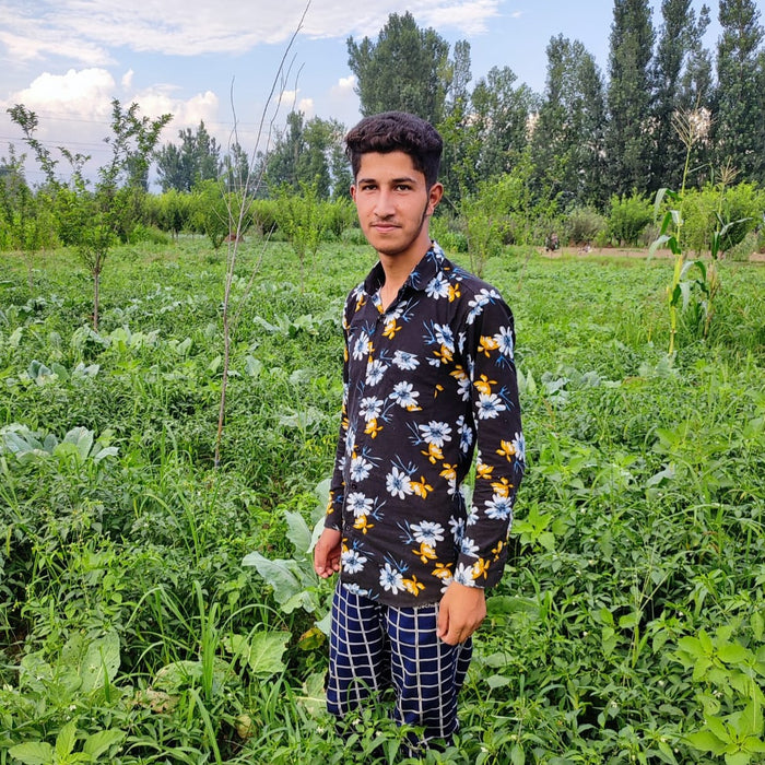 Partner Farmer, Mohsin in Kashmiri Chili field - Burlap & Barrel