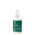 A bottle of Tea Tree Lavender Mint Moisture Milk Leave-In Conditioner on a white background