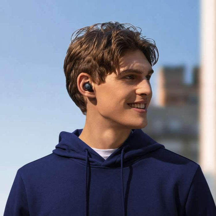 soundcore earbuds worn with casual hoodie