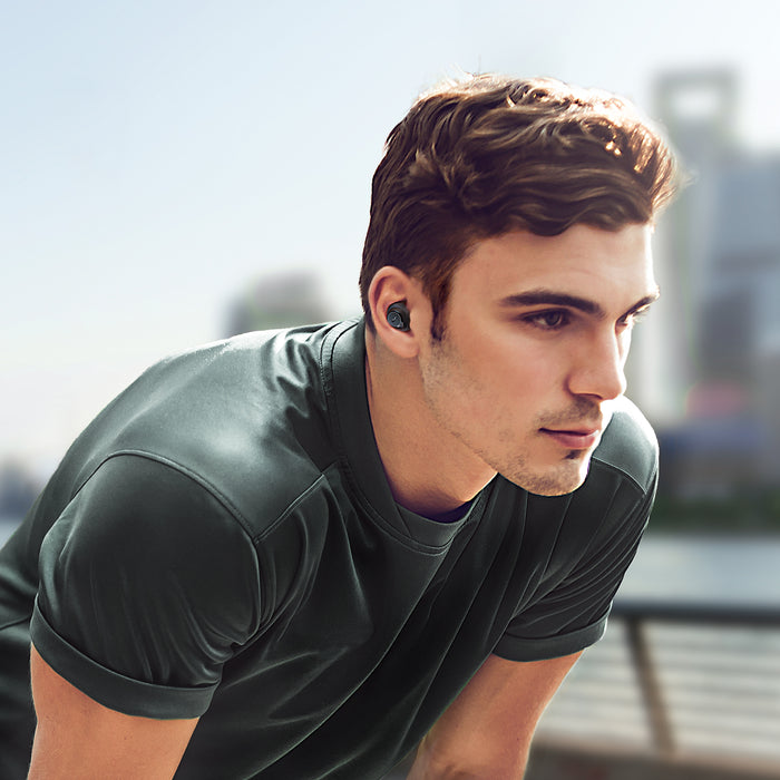 Man jogging with soundcore earbuds