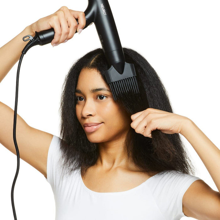 Use the magnetic smoothing pik to lengthen curly or coily hair with a Paul Mitchell Dry or Neuro Dry+ hair dryer.