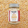 Jar of minced onion spice with 'Burlap & Barrel' label on a textured background