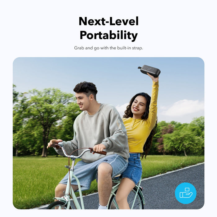 soundcore portable speaker with built-in strap on bike ride