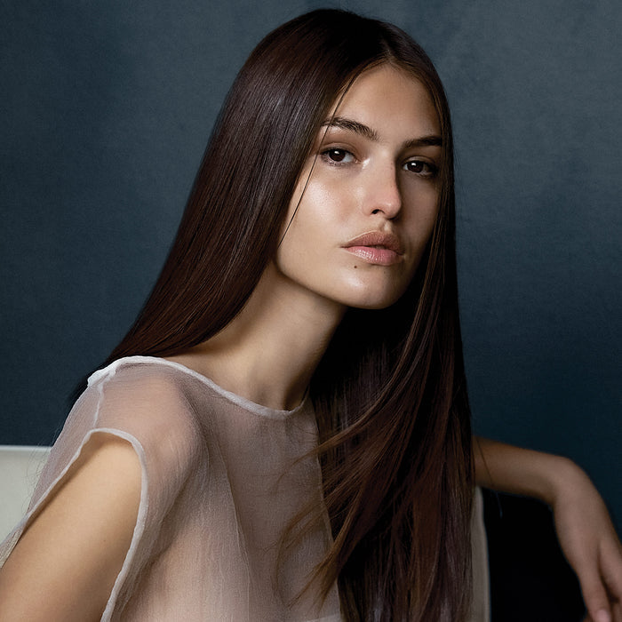image of a woman with long, straight brunette hair