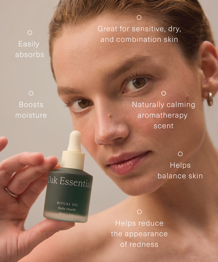 A woman holds a bottle of Ritual Oil near her face. The text highlights easy absorption, moisture boost, aromatherapy scent, balance, and redness reduction for sensitive, dry, and combination skin.
