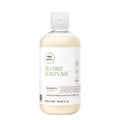 A bottle of Tea Tree Scalp Care Regeniplex Shampoo on a white background