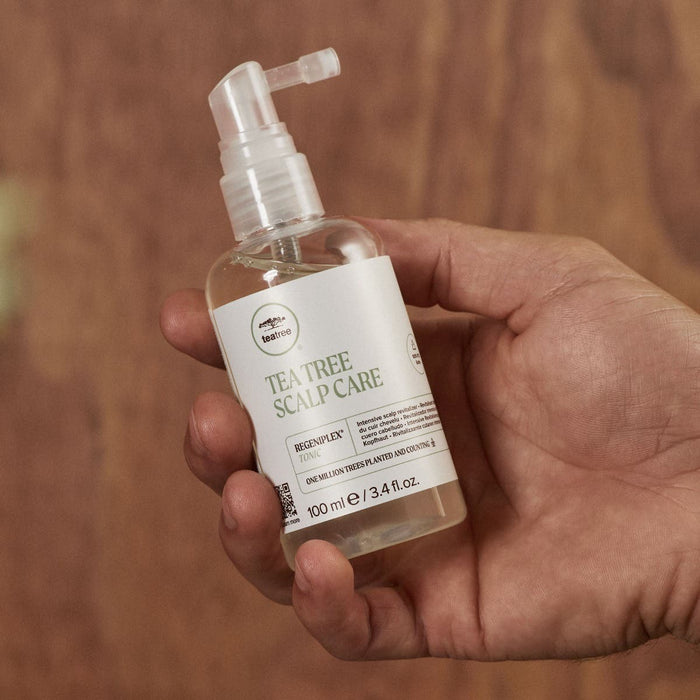 Tea Tree Scalp Care Regeniplex Tonic in hand