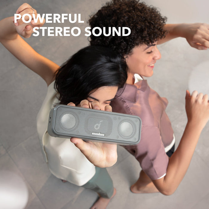 soundcore stereo speaker with people dancing