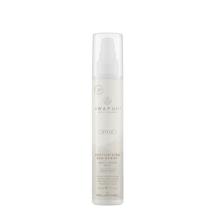 A white aerosol can of texturizing sea spray with a label featuring the brand name Awapuhi Wild Ginger.
