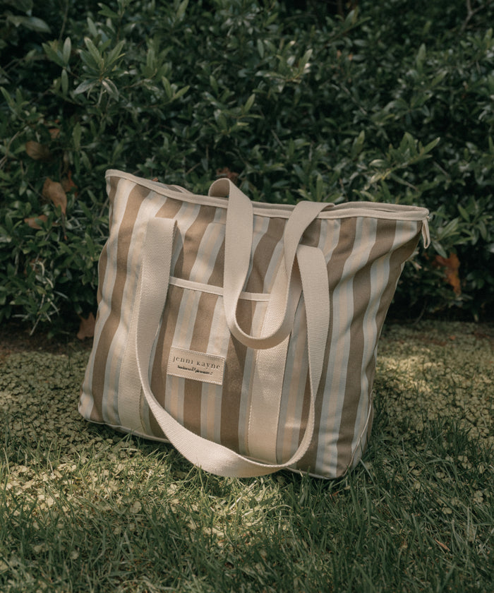 Beach bag with stripes on a grass background