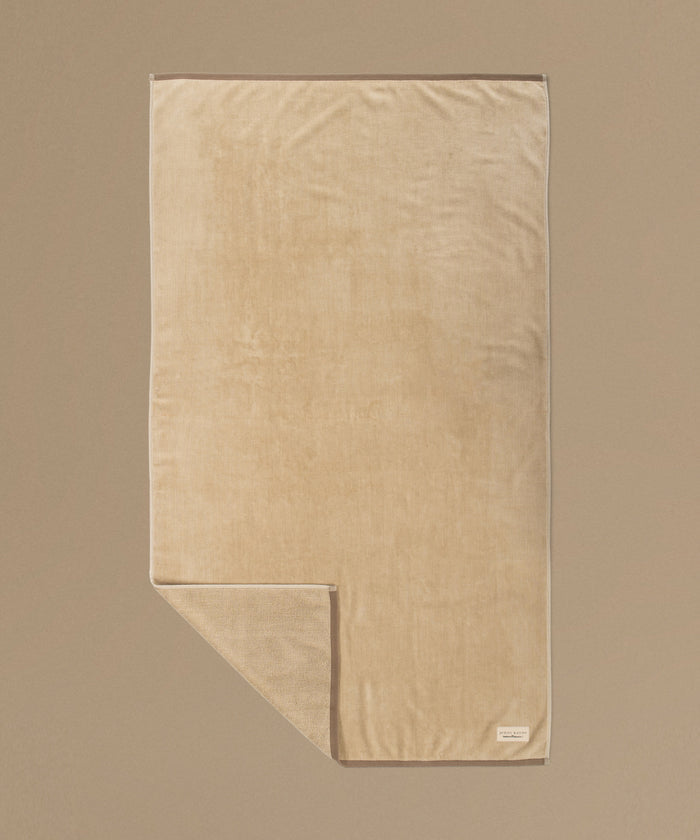 Beige towel on a beige background