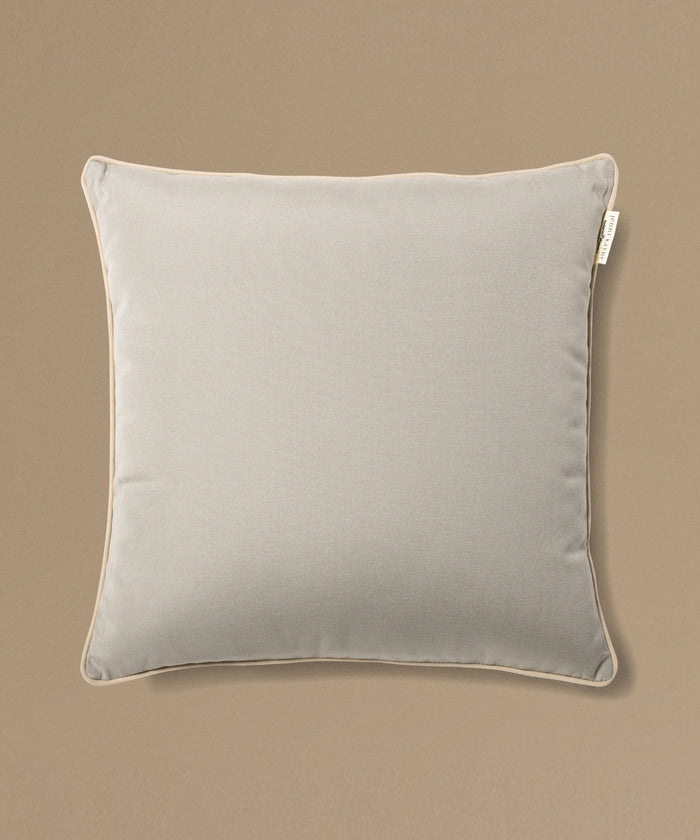 Gray pillow on a beige background