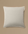 Gray pillow on a beige background