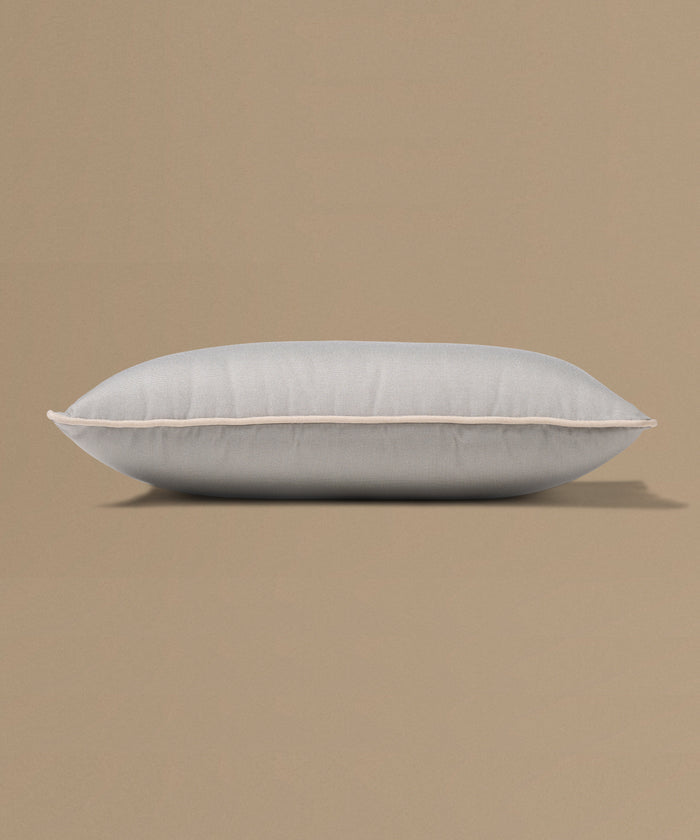 Gray pillow on a beige background