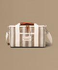 Striped bag with a visible brand label on a beige background