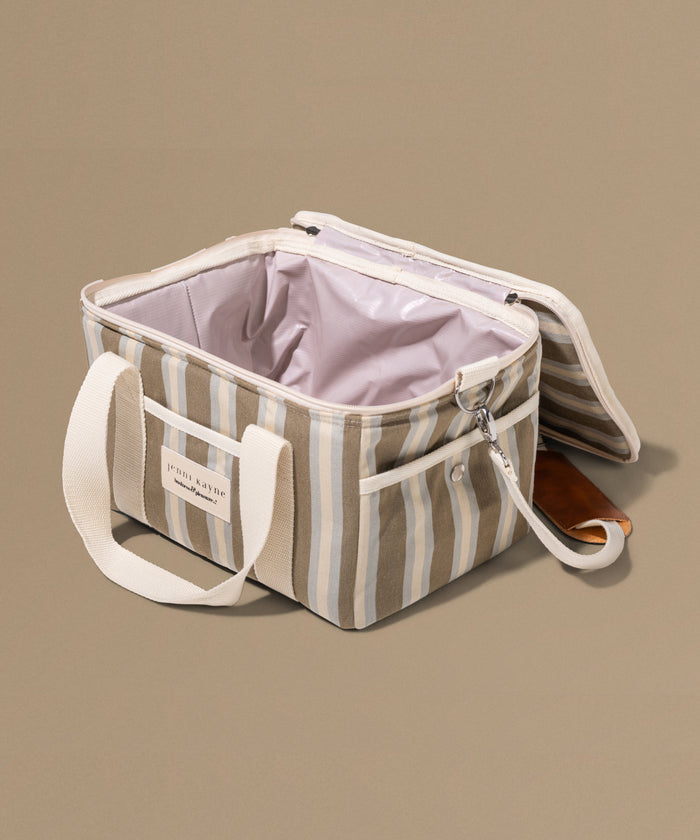 Striped cooler bag with a handle on a beige background