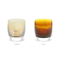 a set of iridescent brown and yellow translucent glassybaby candle holders. 'the reindeer', 'blitzen' and 'vixen' add a warm glow to any holiday occasion.