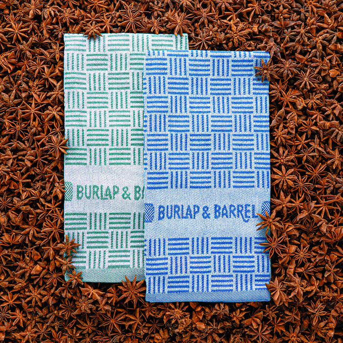 Two patterned towels from Burlap & Barrel on a star anise background